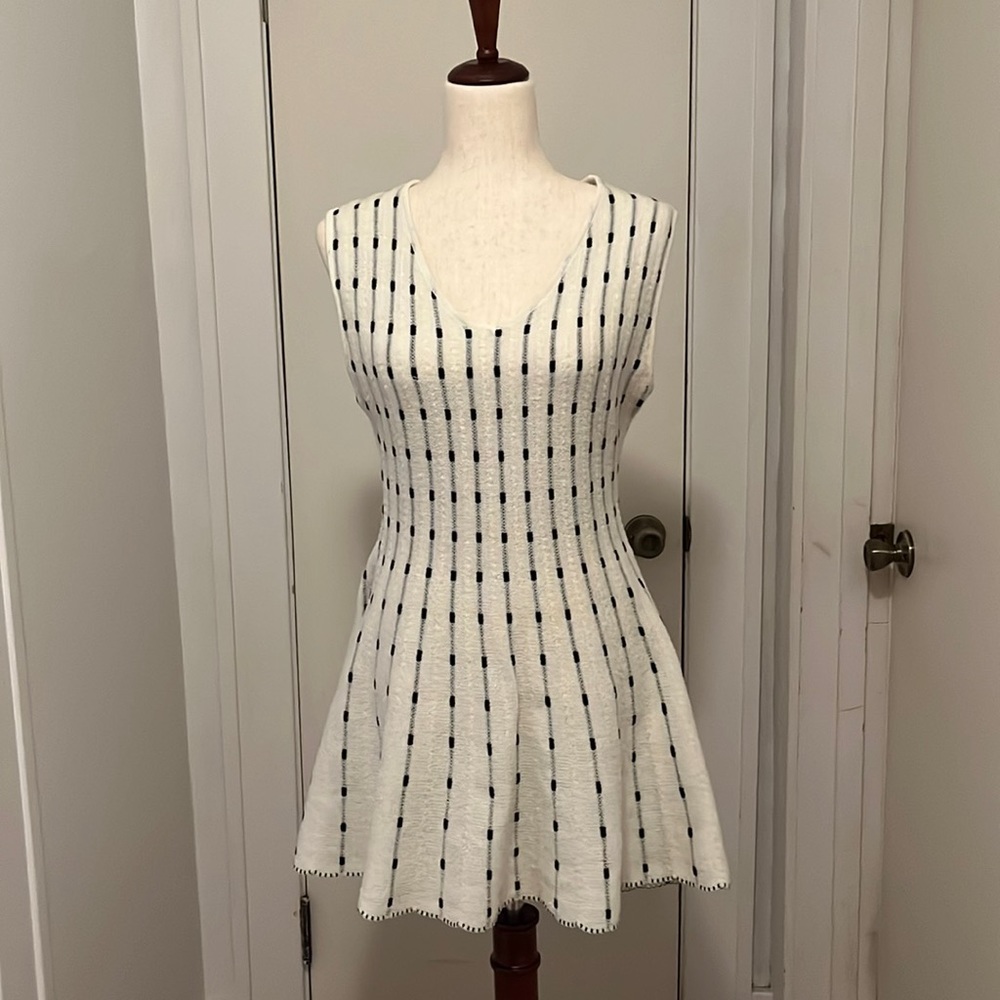 Sleeveless cream and black peplum top size small